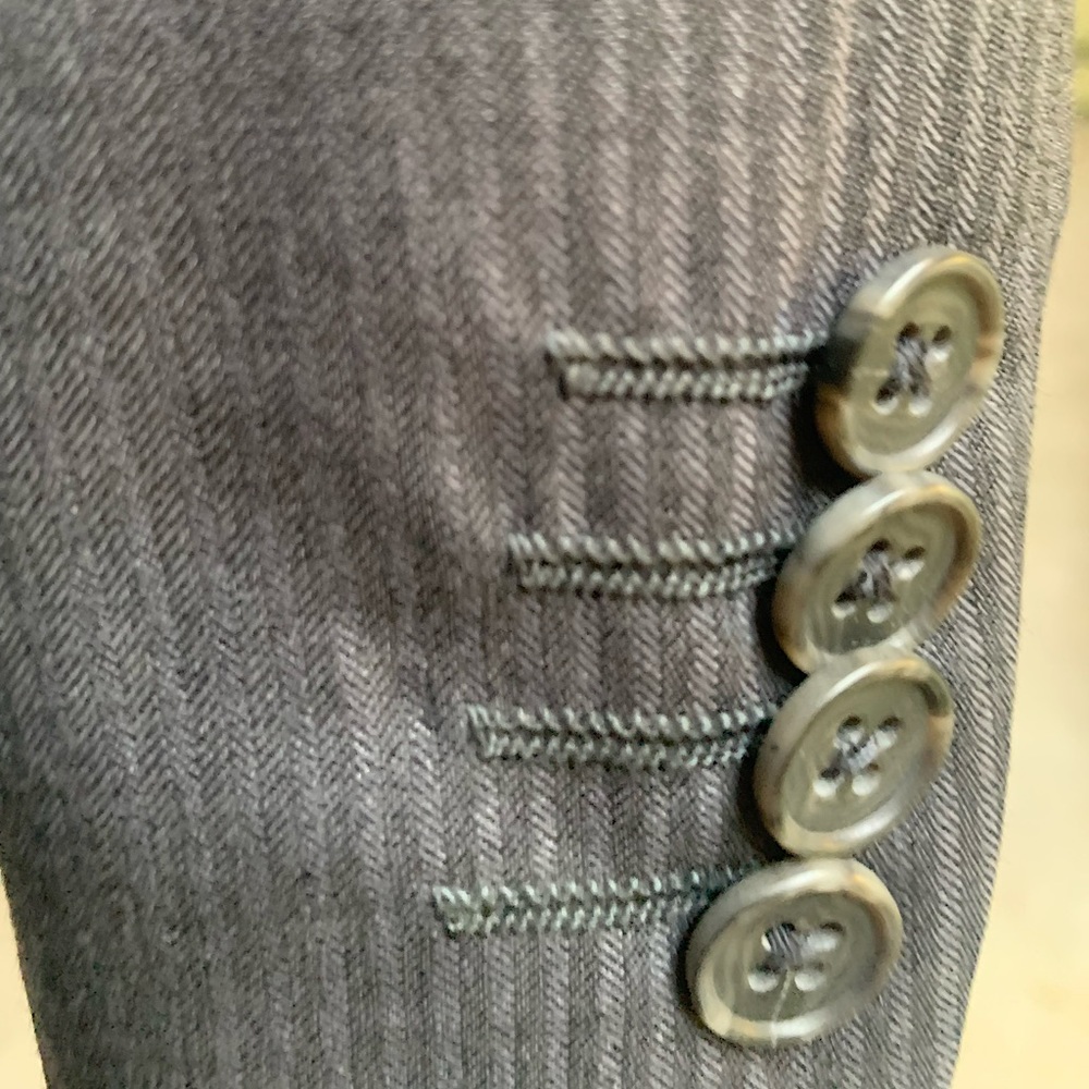 Mens 2 piece lightweight wool suit. Stitched lapels, pocket treatments. Worn 2X